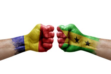 Two hands punch to each others on white background. Country flags painted fists, conflict crisis concept between romania and sao tome and principe
