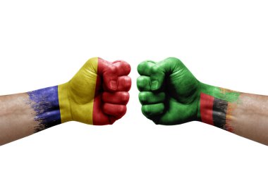 Two hands punch to each others on white background. Country flags painted fists, conflict crisis concept between romania and zambia