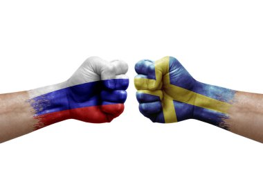 Two hands punch to each others on white background. Country flags painted fists, conflict crisis concept between russia and sweden