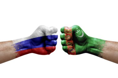 Two hands punch to each others on white background. Country flags painted fists, conflict crisis concept between russia and turkmenistan