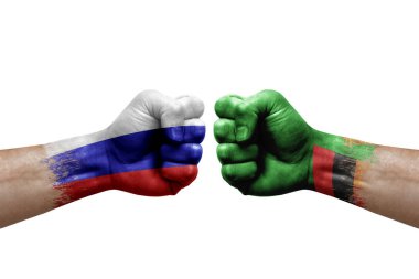 Two hands punch to each others on white background. Country flags painted fists, conflict crisis concept between russia and zambia