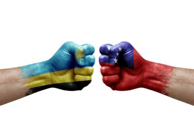 Two hands punch to each others on white background. Country flags painted fists, conflict crisis concept between rwanda and samoa