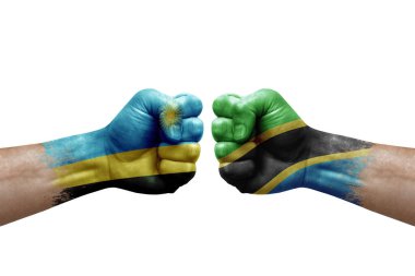 Two hands punch to each others on white background. Country flags painted fists, conflict crisis concept between rwanda and tanzania