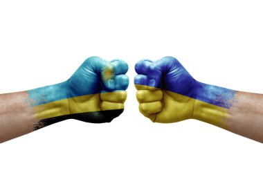 Two hands punch to each others on white background. Country flags painted fists, conflict crisis concept between rwanda and ukraine