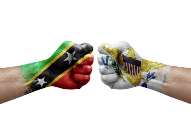 Two hands punch to each others on white background. Country flags painted fists, conflict crisis concept between saint kitts and nevis and virgin islands
