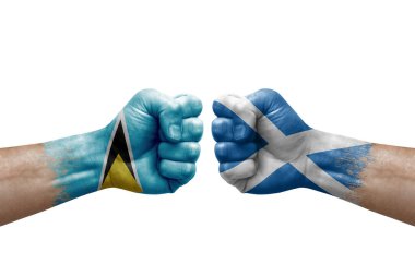 Two hands punch to each others on white background. Country flags painted fists, conflict crisis concept between saint lucia and scotland