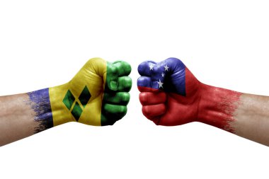 Two hands punch to each others on white background. Country flags painted fists, conflict crisis concept between saint vincent and the grenadines and samoa