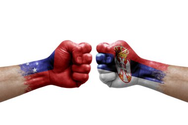 Two hands punch to each others on white background. Country flags painted fists, conflict crisis concept between samoa and serbia