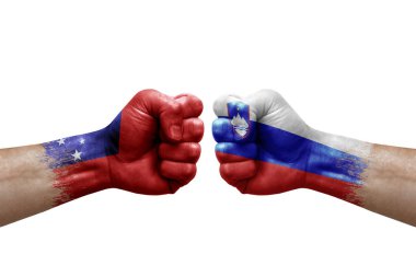 Two hands punch to each others on white background. Country flags painted fists, conflict crisis concept between samoa and slovenia