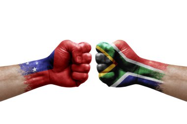 Two hands punch to each others on white background. Country flags painted fists, conflict crisis concept between samoa and south africa