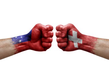 Two hands punch to each others on white background. Country flags painted fists, conflict crisis concept between samoa and switzerland