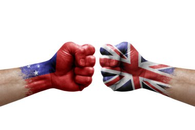 Two hands punch to each others on white background. Country flags painted fists, conflict crisis concept between samoa and united kingdom