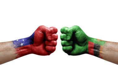 Two hands punch to each others on white background. Country flags painted fists, conflict crisis concept between samoa and zambia