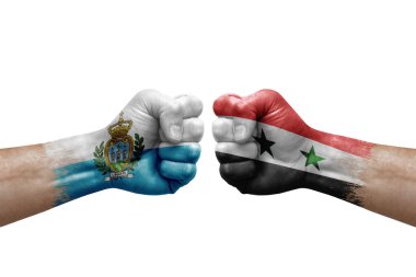 Two hands punch to each others on white background. Country flags painted fists, conflict crisis concept between san marino and syria