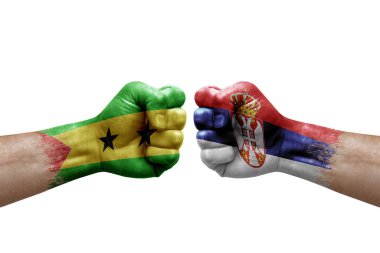Two hands punch to each others on white background. Country flags painted fists, conflict crisis concept between sao tome and principe and serbia