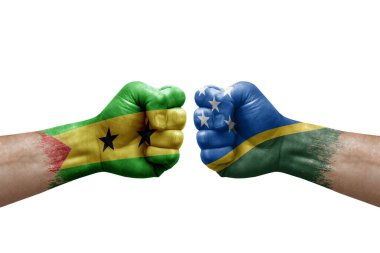 Two hands punch to each others on white background. Country flags painted fists, conflict crisis concept between sao tome and principe and solomon islands