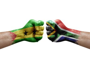 Two hands punch to each others on white background. Country flags painted fists, conflict crisis concept between sao tome and principe and south africa