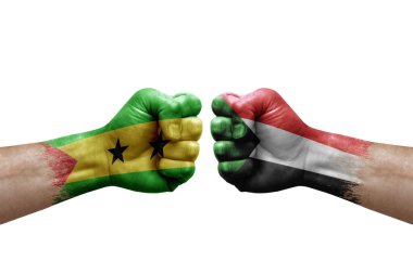 Two hands punch to each others on white background. Country flags painted fists, conflict crisis concept between sao tome and principe and sudan