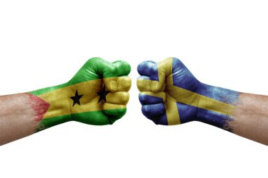 Two hands punch to each others on white background. Country flags painted fists, conflict crisis concept between sao tome and principe and sweden