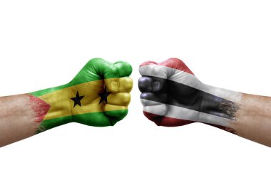 Two hands punch to each others on white background. Country flags painted fists, conflict crisis concept between sao tome and principe and thailand