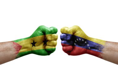 Two hands punch to each others on white background. Country flags painted fists, conflict crisis concept between sao tome and principe and venezuela