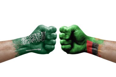 Two hands punch to each others on white background. Country flags painted fists, conflict crisis concept between saudi arabia and zambia