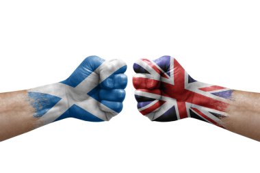 Two hands punch to each others on white background. Country flags painted fists, conflict crisis concept between scotland and united kingdom