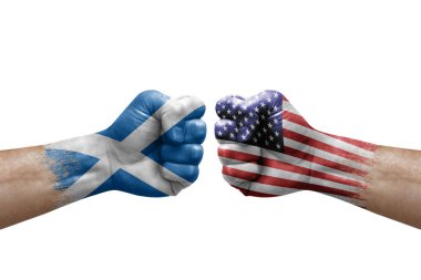 Two hands punch to each others on white background. Country flags painted fists, conflict crisis concept between scotland and usa