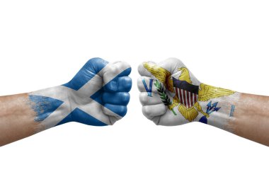 Two hands punch to each others on white background. Country flags painted fists, conflict crisis concept between scotland and virgin islands