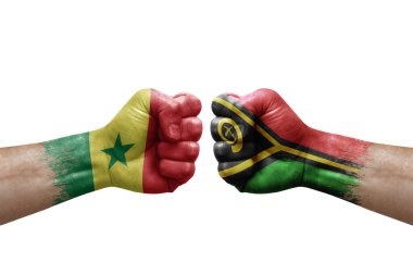 Two hands punch to each others on white background. Country flags painted fists, conflict crisis concept between senegal and vanuatu