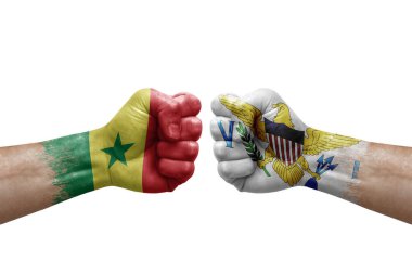 Two hands punch to each others on white background. Country flags painted fists, conflict crisis concept between senegal and virgin islands