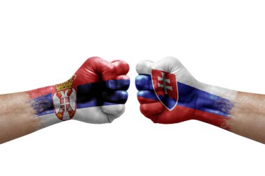 Two hands punch to each others on white background. Country flags painted fists, conflict crisis concept between serbia and slovakia