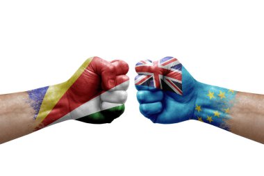 Two hands punch to each others on white background. Country flags painted fists, conflict crisis concept between seychelles and tuvalu