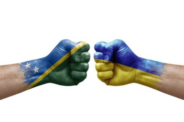 Two hands punch to each others on white background. Country flags painted fists, conflict crisis concept between solomon islands and ukraine