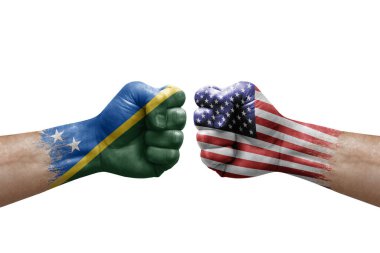 Two hands punch to each others on white background. Country flags painted fists, conflict crisis concept between solomon islands and usa