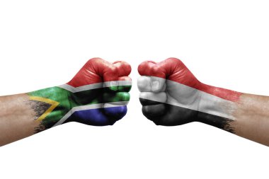 Two hands punch to each others on white background. Country flags painted fists, conflict crisis concept between south africa and yemen