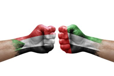 Two hands punch to each others on white background. Country flags painted fists, conflict crisis concept between sudan and united arab emirates