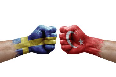 Two hands punch to each others on white background. Country flags painted fists, conflict crisis concept between sweden and turkey