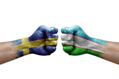Two hands punch to each others on white background. Country flags painted fists, conflict crisis concept between sweden and uzbekistan