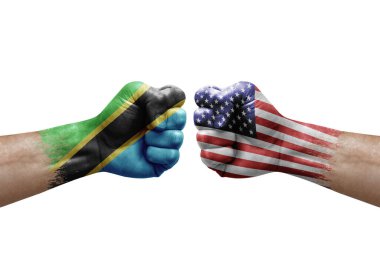 Two hands punch to each others on white background. Country flags painted fists, conflict crisis concept between tanzania and usa