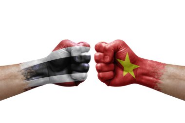 Two hands punch to each others on white background. Country flags painted fists, conflict crisis concept between thailand and vietnam