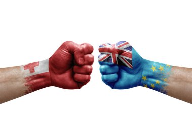 Two hands punch to each others on white background. Country flags painted fists, conflict crisis concept between tonga and tuvalu
