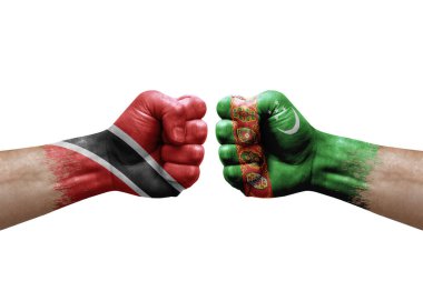 Two hands punch to each others on white background. Country flags painted fists, conflict crisis concept between trinidad tobago and turkmenistan
