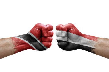 Two hands punch to each others on white background. Country flags painted fists, conflict crisis concept between trinidad tobago and yemen