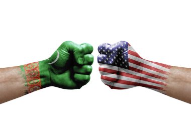 Two hands punch to each others on white background. Country flags painted fists, conflict crisis concept between turkmenistan and usa