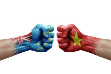 Two hands punch to each others on white background. Country flags painted fists, conflict crisis concept between tuvalu and vietnam