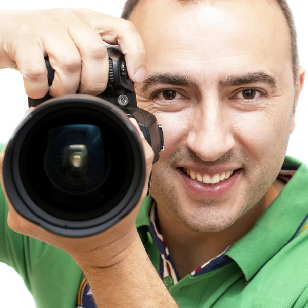 Portret van lachende fotograaf met camera. — Stockfoto