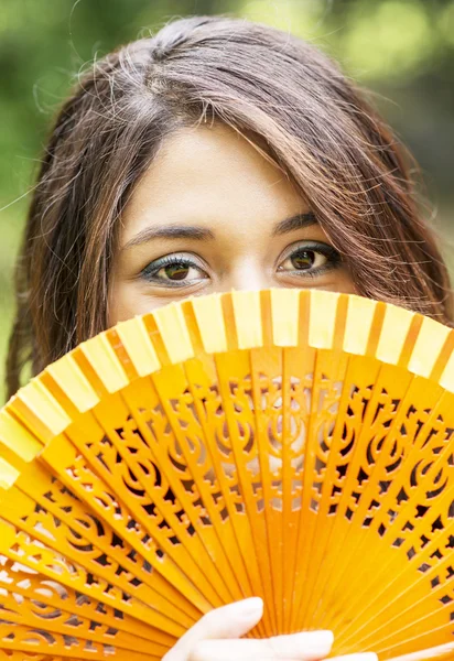Look attractive woman with fan. — Stock Photo, Image