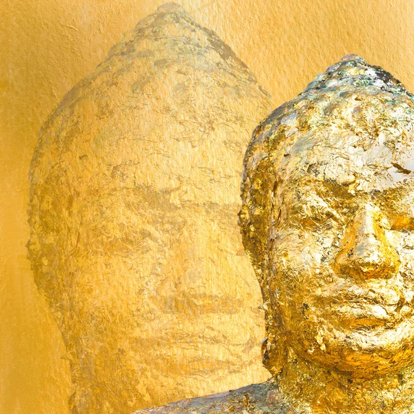 Gold buddha on gold background. Stock Image