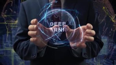 Male hands activate a conceptual holographic text Deep learning. Businessman in a suit with a hologram of planet Earth on a background of a futuristic wireframe city